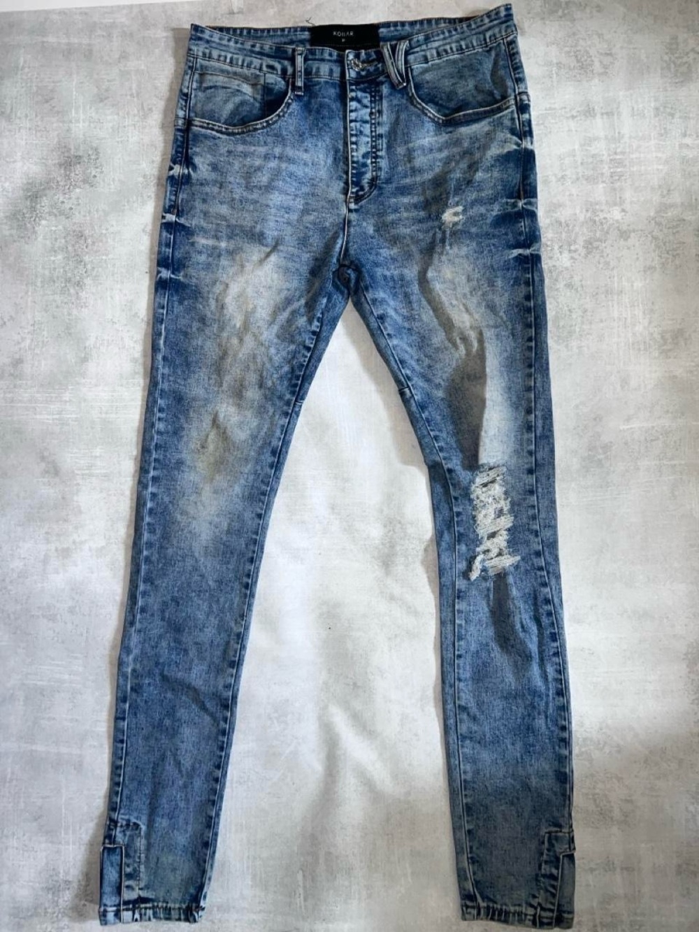 Kollar Denim Visible on the interior waistband tag marking "KOLLAR"